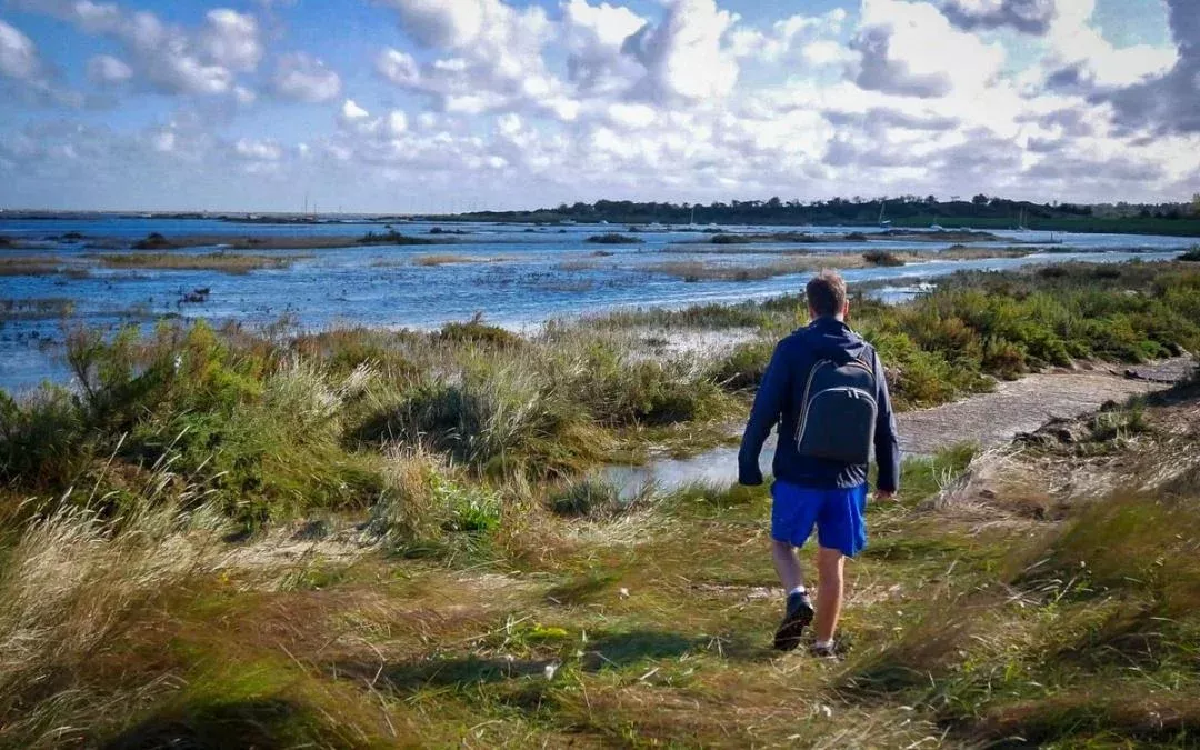 a person wearing blue, Hiking on the coast of norfolk