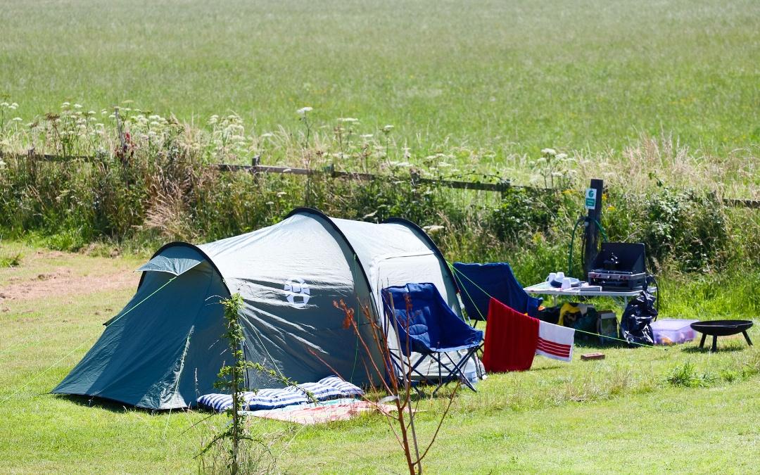 A large tent enjoying views of the Norfolk Countryside here at Hunstanton Camping