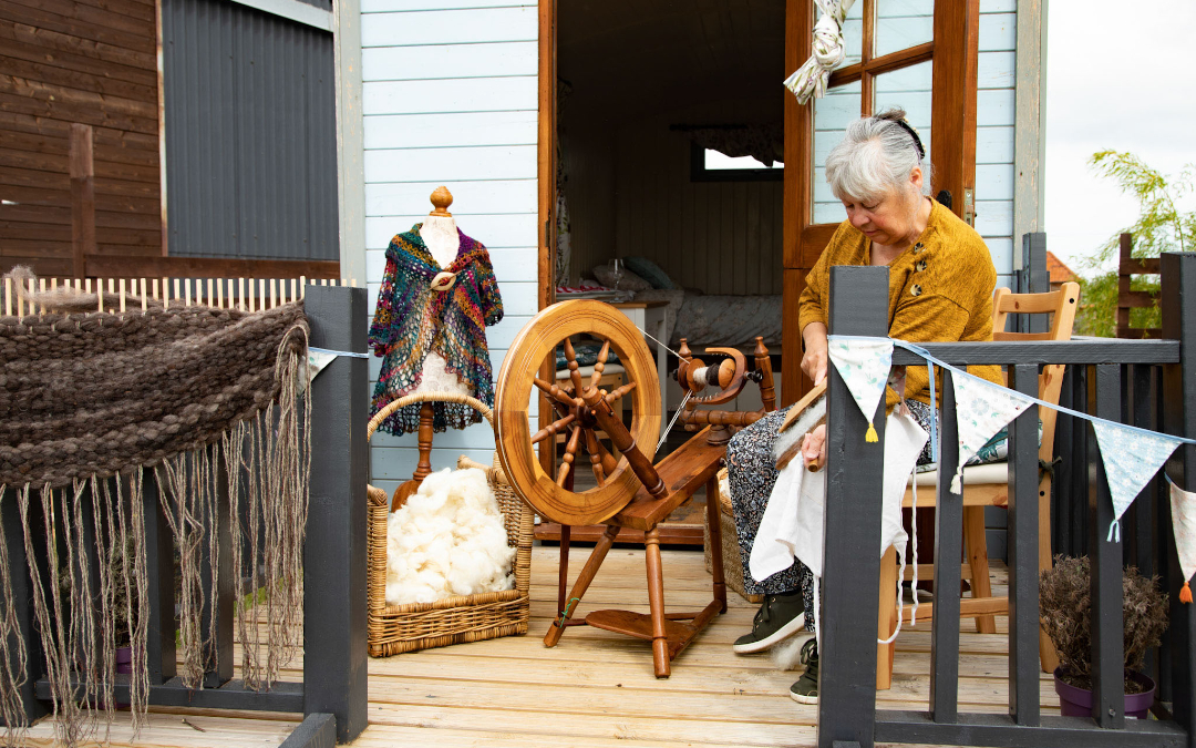 Guest weaving on the deck of our glamping shepherds huts