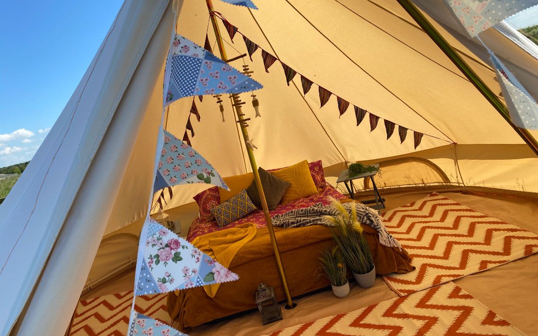 A look inside our glamping bell tents, with comfy double beds and stylish furnishings here at Norfolk Coast Path  Glamping
