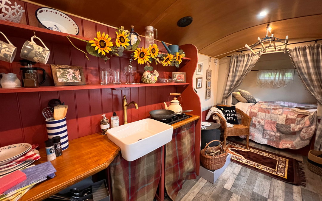 Shabby Chic Shepherds Hut Glamping with double bed and woodburner at Holt Hollow