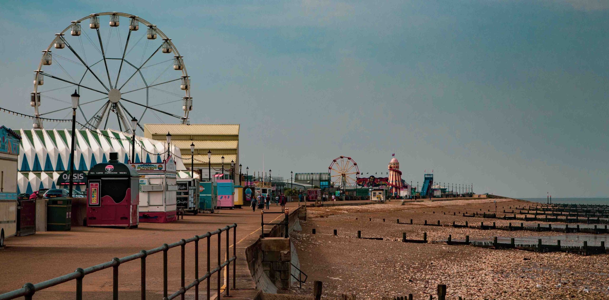 Rainbow Park on the edge of Hunstanton pier with the beach and sea on the right