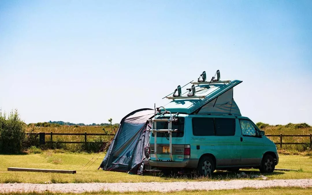 camping with your campervan with awning pitched up on a campsite
