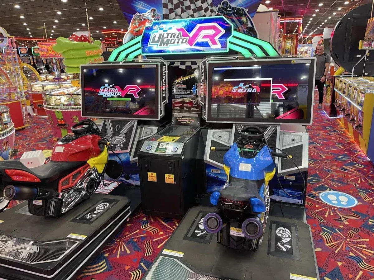 arcade machine with motorbikes and vr